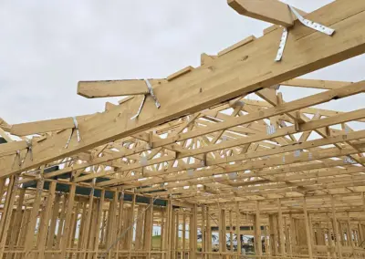 Installation of a large garage beam using construction timber at a site in Queensland.
